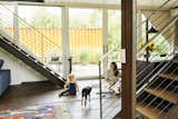Victoria and her daughter, Bowie, along with the family dog, in the open kitchen/dining area.