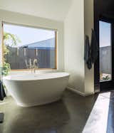 The couple’s bathroom features a mineral composite tub from MTI.