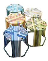 Vibrant colors distinguish this clever stool by Miami’s AMLgMATD. Relying on deadstock poly-propylene webbing (leftovers from bygone lawnchair companies) and colorful aluminum tubing, the upcycled piece makes a sunny companion.&nbsp;