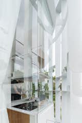 Exterior, Glass Siding Material, and Metal Siding Material  Photos from A Translucent Tower in Vietnam Invites Visitors in for a Cup of Coffee