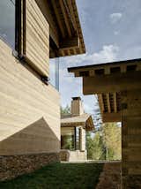 Exterior, Wood Siding Material, Shingles Roof Material, House Building Type, and Stone Siding Material  Photos from A Kinetic Facade Opens This Spectacular Mountain House to the Grand Teton Landscape