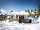 Exterior, House Building Type, Stone Siding Material, Wood Siding Material, and Shingles Roof Material  Photos from A Kinetic Facade Opens This Spectacular Mountain House to the Grand Teton Landscape