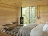 Bedroom, Light Hardwood, Bed, Shelves, Rug, and Recessed  Bedroom Rug Light Hardwood Shelves Photos from A Kinetic Facade Opens This Spectacular Mountain House to the Grand Teton Landscape