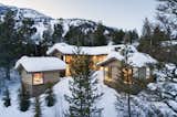 Exterior, Stone Siding Material, Wood Siding Material, House Building Type, and Shingles Roof Material  Photos from A Kinetic Facade Opens This Spectacular Mountain House to the Grand Teton Landscape