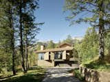 Exterior, House Building Type, Wood Siding Material, Shingles Roof Material, and Stone Siding Material  Photos from A Kinetic Facade Opens This Spectacular Mountain House to the Grand Teton Landscape