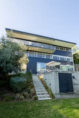 The trilevel home spills onto a grassy knoll that overlooks the Hollywood Hills and Downtown Los Angeles.