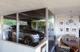 While parked in the carport, automobiles become a part of the interior design. Here, the Genesis GV80 can be seen from the dining area.
