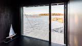 From inside the cabin, a massive window and extended deck grant views over Helsinki’s scenic archipelago.  