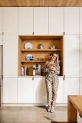 Lalita stands in front of the coffee nook in the couple’s kitchen—one of several details that relates to their shared Brazilian heritage. Her childhood was split between São Paulo and Rio de Janeiro, while Fabio grew up in São Paulo before moving to various cities around the world as part of his career in advertising.