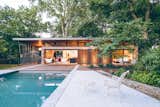 In Denton, Texas, this backyard guesthouse by Dallas-based practice M Gooden Design echoes the midcentury aesthetic of the primary residence. The homeowners were in need of extra space to host visitors, but instead of expanding the footprint of their two-bedroom home, they decided a separate dwelling was a better option.