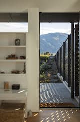 Perforated metal walls protect the patio from the area’s intense winds.