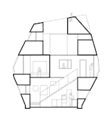 A section drawing shows how the nook-like living spaces on the upper levels revolve around the central atrium. The air gaps between the envelope and the interior are as wide as 13 feet in some places. In addition to insulating the house, they conceal technical systems and provide storage space.