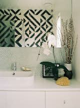 Chris customized the main bathroom’s patterned Granada cement tiles. The sink is by Duravit.