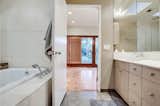 The en suite bathroom offers a large soaking tub and double skylights.&nbsp;