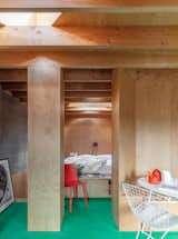 Noiascape Studio designed the various areas in the studio to be separated by bespoke joinery. The wood-lined sleeping area features a custom Kerf Works bed.