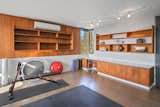 The en suite office/workout area features a built-in workspace and shelving.