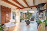 Another view of the living space highlights one of the many indoor/outdoor connections found throughout the two-level residence—a signature of May’s designs.   Photo 3 of 12 in A Renovated Cliff May–Designed Home in a Historic SoCal Enclave Asks $1.5M