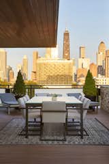 Outdoor, Planters Patio, Porch, Deck, Large Patio, Porch, Deck, Decking Patio, Porch, Deck, and Rooftop Views from the rooftop also overlook the world-famous Chicago skyline, including sights such as the 100-story skyscraper at 875 North Michigan Avenue, colloquially known as the John Hancock Center.  Photo 3 of 7 in From Rooftops to Backyards, Now Is the Best Time to Design Your Dream Outdoor Space