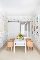 Chango &amp; Co. built a home in Westchester, New York, for a young couple and their newborn baby. Here, the playroom is outfitted with furniture from Finnish Design Shop and Bien Fait wallpaper inspired by childish doodles.