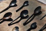 Pieces of discarded blackwood with white markings—supposedly undesirable features for mainstream wood products—lend a rough-hewn character to the handcrafted spoons.