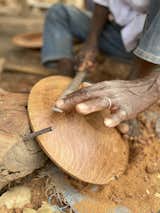 Using techniques passed down through generations, Amadou has mastered the art of hand-carving traditional wooden bowls without complex machines or fancy gadgets.