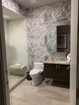 Before: The old vanity and sconce in the bathroom were replaced.