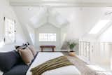 Vaulted ceilings enhance the sense of space in the lofted sleeping area.