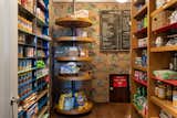Steps from the kitchen is a store-like pantry, which once functioned as a working sound studio. The room is still fully sound-proofed and features a tiny hatch that leads to a secret play area.