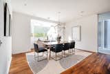 An airy dining area is located steps away from the kitchen.&nbsp;