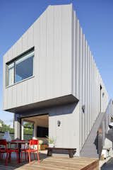 When a family outgrew their two-bedroom, one-bathroom home in Los Angeles’s West Adams neighborhood, they were too smitten with the area to leave, so they decided to expand into the backyard. While renovating the existing residence, OKB Architecture designed a detached two-story dwelling that fits perfectly at the rear of the narrow lot.