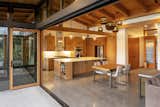 Elements that work for a wide range of ages and abilities include level transitions, lever-style handles, a low-set double wall oven, and a lower counter.  Photo 13 of 13 in Accessibility Is Only the Beginning—Architecture Needs to Embrace the Full Range of Human Abilities