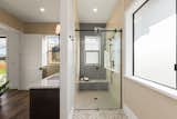 The bright, open interior features a zero-step entry, 33-inch-wide doorways, a curbless shower, and backing in the shower and beside the toilet for future grab bars.  Photo 10 of 13 in Accessibility Is Only the Beginning—Architecture Needs to Embrace the Full Range of Human Abilities