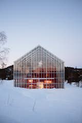 The home of architect Margit-Kristine Solibakke Klev and her husband, Arnstein Norheim, is built inside an enormous greenhouse.