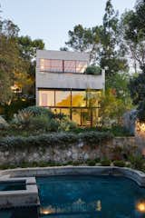 Thick vegetation surrounding the two-acre property ensures ample privacy for residents seeking a tranquil city escape.