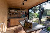 A well-equipped kitchenette spans one of the walls in the 10-by-13-foot prefab.