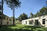 An expansive inner courtyard offers a secluded open-air retreat fringed by the towering pines of the surrounding forest.