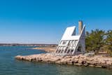 New Haven–based architect Vincent C. Amore designed and built the geometric retreat in 1971 to serve as an inspirational getaway for his family. Set on the edge of Guilford, Connecticut, the home offers 1,149 square feet of living space, as well as unobstructed seaside views.