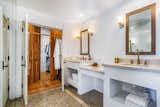 All four bathrooms are newly renovated. Here is a look at the principal bath, which connects to a spacious walk-in closet.