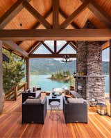 The covered section on the upper deck features a vaulted timber ceiling.  Photo 5 of 10 in A Three-Level Redwood Deck Spurs a Spellbinding Link to Nature Near Cascade Bay