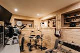A look at the wood-clad basement, currently serving as a fully equipped recording studio.
