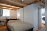 While housed in the semi-basement level, the bedroom is illuminated with ample natural light.