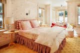 Another one of the bedrooms is dressed in light shades of pink and yellow.