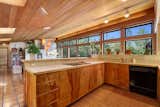 All of the birch cabinetry in the kitchen is original to the home.&nbsp;