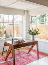 The front sunroom features windows on three sides and overlooks the Venice Walk Street garden.