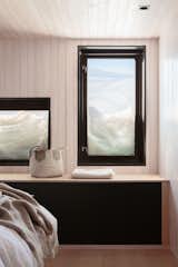 The ceilings in the living areas enhance a sense of openness, while those in the bedrooms are lowered for a cozier feel.