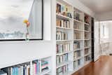 The upper level features 100 linear feet of built-in bookshelves.