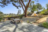 At the top of the terraced lot, another outdoor gathering area offers a private, shaded setting with picturesque views of the surrounding canyons.