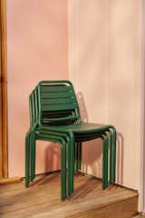 Floyd’s outdoor chairs (seen here in Jade) are stackable and easy to stow away when not in use.