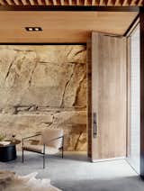 Living Room, Coffee Tables, Concrete Floor, Ceiling Lighting, Chair, and Rug Floor  Photo 3 of 10 in A Private Wine Cave Is Built Into a Limestone Hillside in Texas