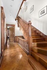 An intricate banister adds sophisticated flair to the home’s main staircase.